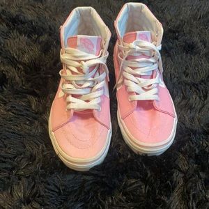 Pink and white vans.
